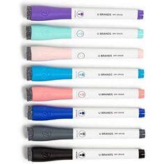 five different colored pens lined up next to each other on a white surface with the words u - brands written on them