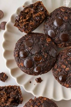 chocolate chip cookies on a plate with one cut in half