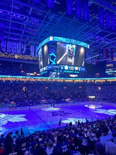 an ice hockey stadium filled with lots of people