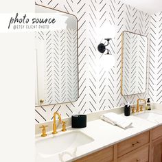 the bathroom is decorated in black and white herringbones, with gold faucets