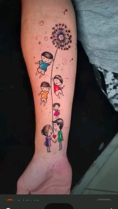 a woman's arm with an image of two children holding hands and a dandelion tattoo on it