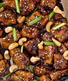 chicken and cashews with sesame seeds in a brown sauce