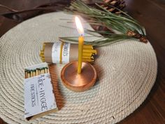 a candle and some matches on a table