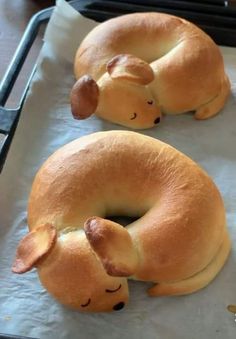 two buns shaped like animals laying on top of each other