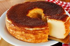 a bundt cake on a plate with a slice cut out