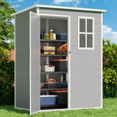 an outdoor storage shed with the door open and shelves full of items in front of it