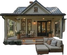 a porch with furniture and lights on the front steps, in front of a house