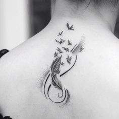 the back of a woman's neck with birds flying around her and an arrow on it