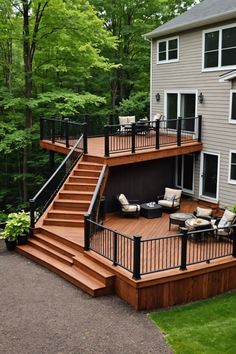 an outdoor deck with stairs and seating area