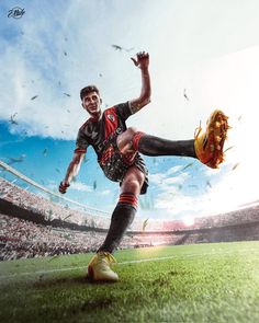 a man kicking a soccer ball on top of a field