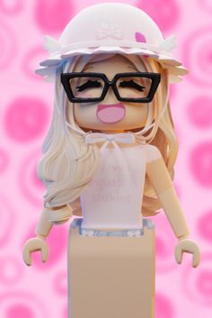 a lego figure wearing glasses and a white hat with her tongue out in front of a pink background