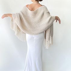 Winter shawl, bridal wedding  wrap, beige cover up, fringed wool scarf, mohair evening stole, bridesmaid gift, rectangle shawl, warm  This versatile beige wrap piece not only complements any outfit but also provides warmth and protection from the chilly weather throughout fall, winter, and spring. These cover up's make an excellent bridesmaid gift. Fuzzy and warm yarn. it is not itchy at all. My proucts are handmade. MATERİAL: 10% mohair, 10% wool, 80% premium acrylic-Polyamid, COLOR:BEIGE (AS SHOWN) MEASUREMENTS: (Average) Length: 67'' (170 CM) Width:20'' (50 CM) (without fringes) If you are in a hurry, please contact with me expedite shipping available CARE INSTRUCTIONS: - Wash at low temperature on a gentle machine cycle - Do not tumble dry - Line dry - Do not wring to remove excess wat Bridal Cover Up, Winter Wrap, Winter Shawl, Wool Wrap, Wedding Shawl, Wedding Wraps, Chilly Weather, Warm Scarf, Wool Scarf