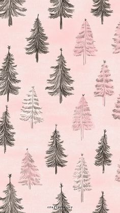 a pink wallpaper with black and white christmas trees on it's back ground