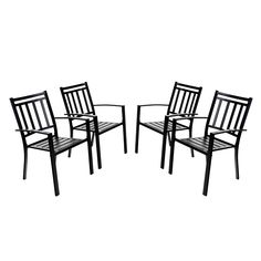 four black chairs sitting next to each other