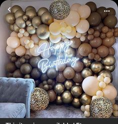 a birthday party with balloons and streamers on the wall