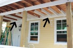 an image of a house being built with wood framing and white trim on the windows