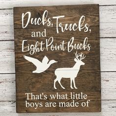 a wooden sign that says ducks, trucks and eight point bucks that's what little boys are made of