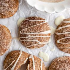 cinnamon sugar donuts with icing drizzled on them