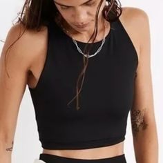 Madewell Mwl Form Racerback Crop Tank Top Black Na554 The Fabric: Supersoft With Zero See-Through, Mwl Form Has Four-Way Stretch For Holds-You-Up Compression, Bounce-Back Recovery And Maximum Flexibility. The Fit: This Fully Lined Crop Has A High '90s Neckline And A Cutaway Racer Back (Wear It For Low-Impact Yoga Flows Or As A Top With High-Rise Jeans Or Leggings). Made For: Yoga Flows Or Tiktok Scrolls. Compressive. Moisture Wicking. Made Of 82% Recycled Nylon/18% Spandex. Do Well: Nylon Is Rec Casual Sports Bra With Scoop Neck, Casual Scoop Neck Sports Bra, Trendy Black Sports Bra With Medium Support, Black Scoop Neck Sports Crop Top, Sporty Black Cami Top, Everyday Crop Top With Medium Support, Black Scoop Neck Crop Top For Gym, Trendy Black Racerback Sports Bra, Versatile Black Crew Neck Crop Top