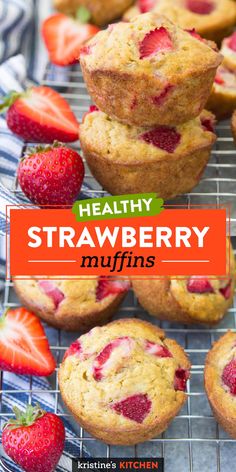 healthy strawberry muffins on a cooling rack with strawberries