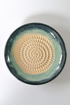 a ceramic bowl with a circular design on it