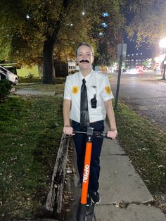 a man in a police uniform on a scooter with fake moustache