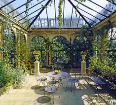 an outdoor dining area with tables and chairs