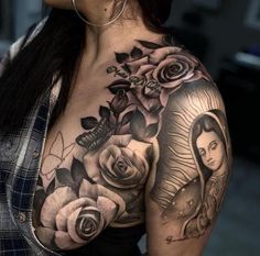 a woman's shoulder with roses and a virgin mary tattoo on her left arm