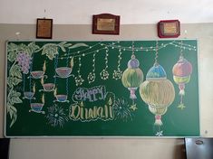 a chalk board with hanging lanterns on it