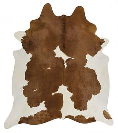 a brown and white cowhide rug on a white background