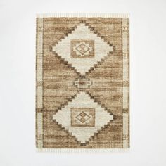 a brown and white area rug on a wall