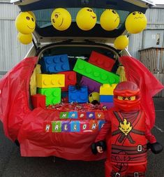 a car trunk filled with legos and balloons