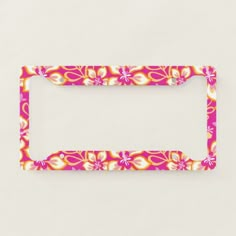 a pink and yellow flowered license plate frame on a white background with clipping