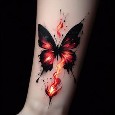 a butterfly tattoo on the ankle with flames coming out of it's back legs