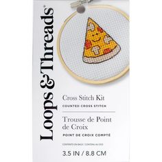 a cross stitch kit with a piece of pizza on it