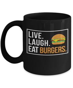 a black coffee mug that says live laugh eat burgers