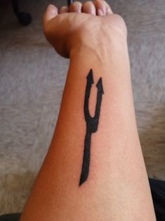 a person with a tattoo on their arm