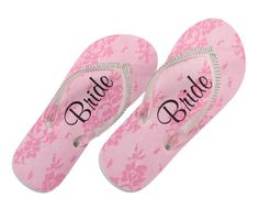 two pink flip flops with the word bride printed on them