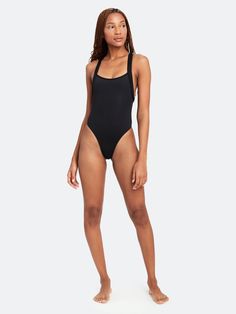 a woman in a black one piece swimsuit