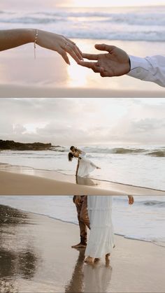 two people reaching out to touch each other on the beach