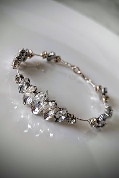 a close up of a bracelet on a plate