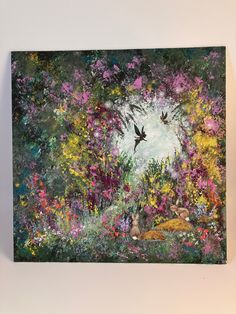 a painting with birds flying over flowers and trees in the background, on a white wall