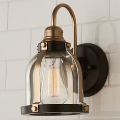 an old fashioned light fixture on the wall