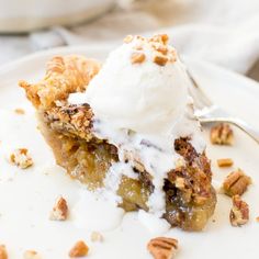 a slice of pecan pie with whipped cream on top