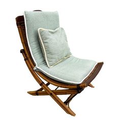 a wooden rocking chair with a cushion on it's back and seat padding