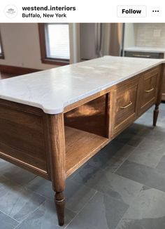 a white marble top coffee table in a kitchen