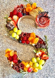 the letter s is made up of fruits and vegetables to spell out the number 3