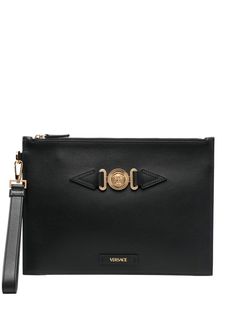 Medusa-plaque detail clutch bag from VERSACE featuring rectangle shape, Medusa plaque detail, wrist strap, logo patch to the front, top zip fastening, jet black and calf leather. | Versace Medusa-plaque detail clutch bag Fashion Quotes Pink, Versace Clutch, Versace Slides, Quotes Pink, Versace Gold, Latest Bags, Versace Bags, Versace Wallet, Bags Logo