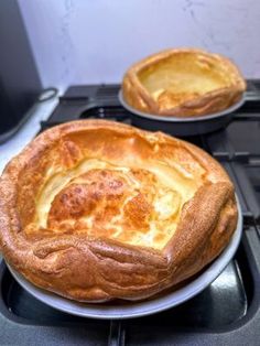 two pies sitting on top of an oven