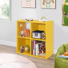 a child's room with toys and bookshelves in yellow, green and pink